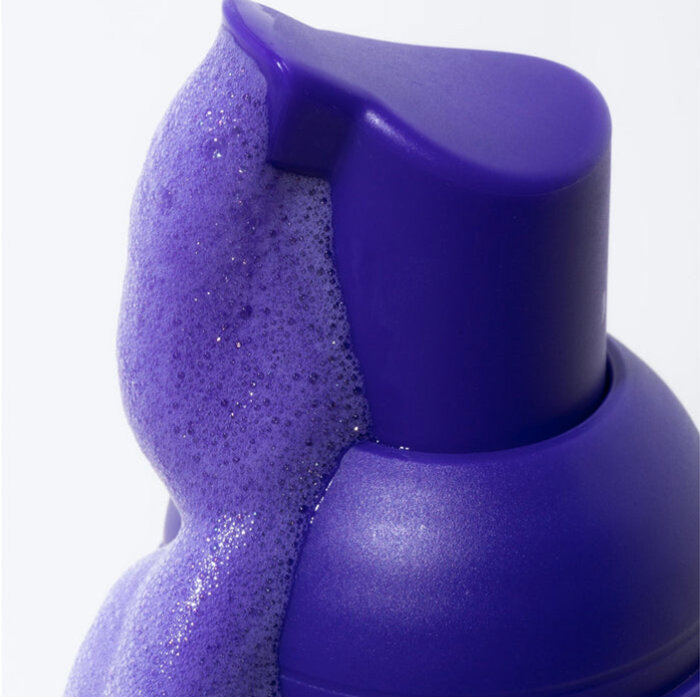 Applying the WellaWhite foam to a toothbrush